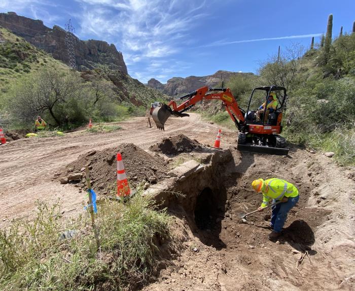 ADOT crew removing dirt from drainage along SR 88