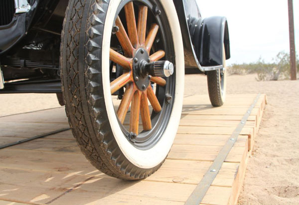 Vintage Model T car displayed on a reconstructed section of the historic Plank Road near Yuma, Arizona.