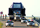 Escort Information and Guidelines Escort Information and Guidelines: wide-load vehicle being escorted on highway