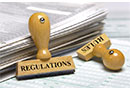 Rules and Regulations Rules and Regulations - Stamps on a stack of papers